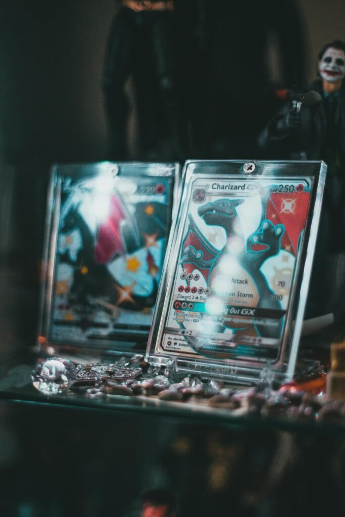 Close-up of collectible Pokemon trading cards in protective cases on display.